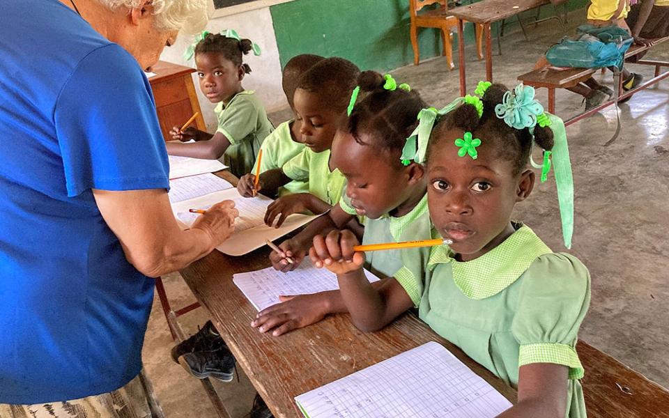 Sr. Rosario Fumnal, a member of the Religious of Jesus and Mary from Spain, teaches preschool students in Haiti. (Patricia Dillon)