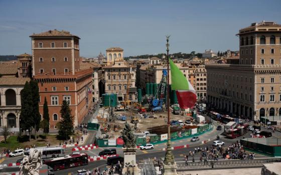 For the next four years at least, central Piazza Venezia and its Imperial Forum-flanked boulevard to the Colosseum are scheduled to be congested and blighted by giant, 14-meter high green silos that are needed for theonstruction site of a major underground hub in central Piazza Venezia in Rome May 9. (AP/Alessandra Tarantino)