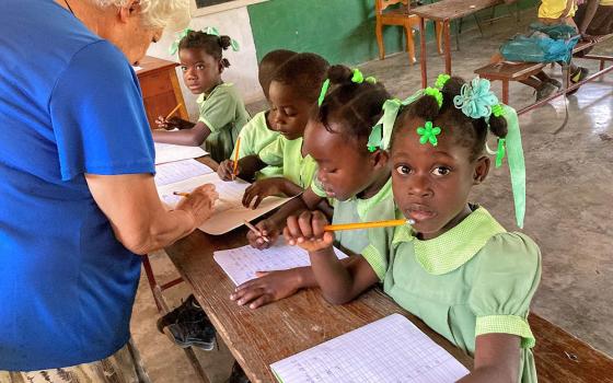 Sr. Rosario Fumnal, a member of the Religious of Jesus and Mary from Spain, teaches preschool students in Haiti. (Patricia Dillon)