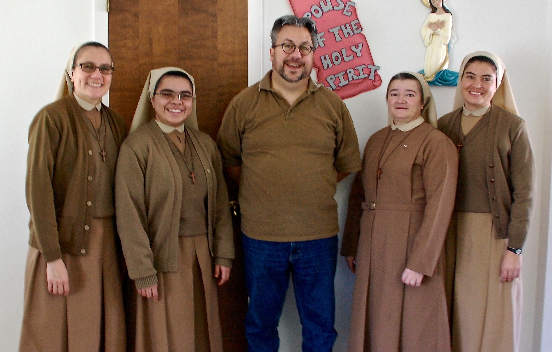 Dan Stockman, national correspondent for Global Sisters Report, stands with Missionary Servants of the Divine Spirit sisters in Michigan in 2015. 