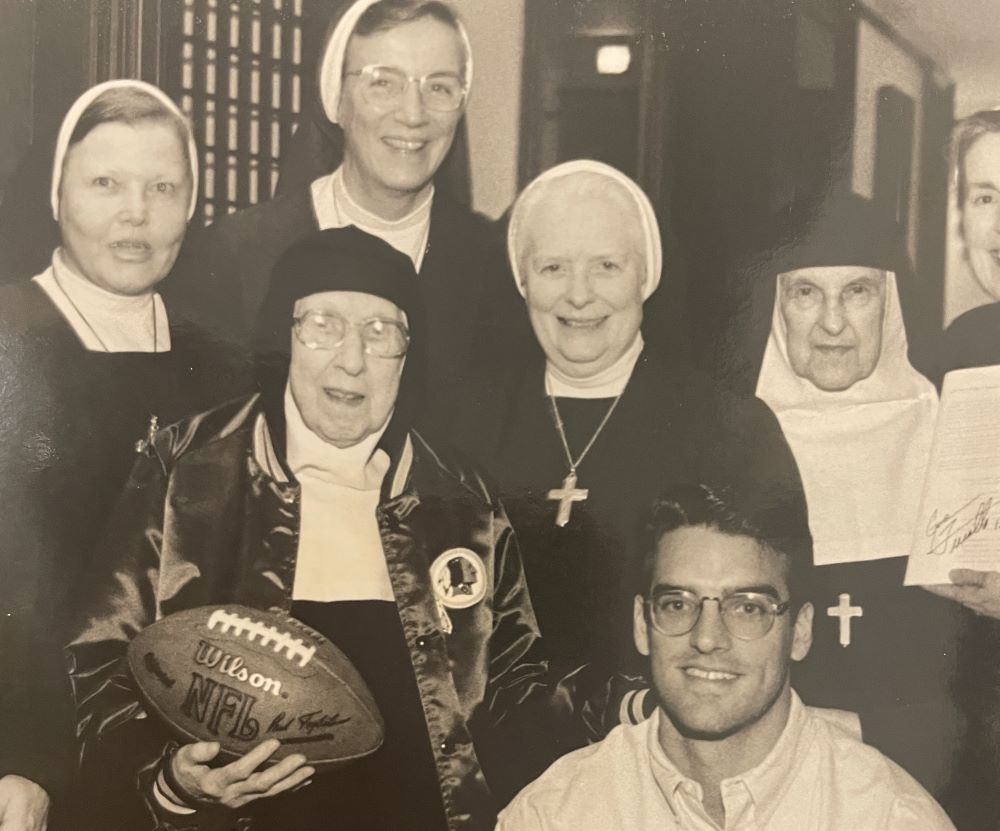 Visitation Sr. Marie Louise Kirkland holds the pigskin with Washington Redskins player Gus Frerotte on her 97th birthday in 1996. Others are (from left) Sr. Mada-anne Gell, Sr. Philomena Tisinger, Sr. Mary Berchmans Hannan and Sr. Anne Marie Di Menno. 