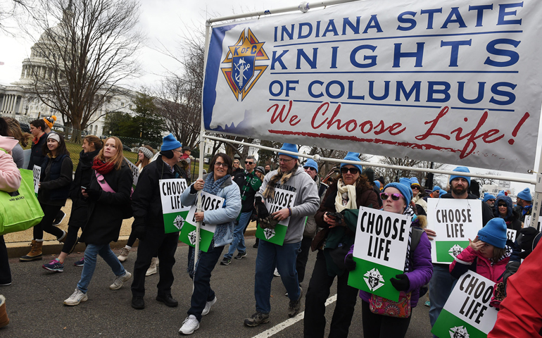 Pro-life advocates with the Indiana State Knights of Columbus carry a banner past the U.S. Supreme Court Jan. 27 during the annual March for Life in Washington. (CNS/Leslie E. Kossoff)