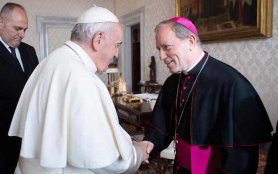 Pope Francis greets Bishop Robert Gruss of Saginaw, Mich., during a meeting with U.S. bishops from Ohio and Michigan making their "ad limina" visits to the Vatican Dec. 10, 2019. 