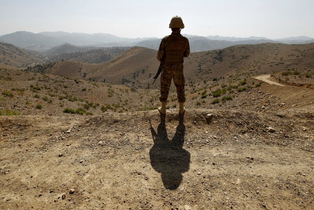 A soldier in North Waziristan, Pakistan, stands guard along the border fence with Afghanistan Oct. 18, 2017. (CNS/Reuters/Caren Firouz)