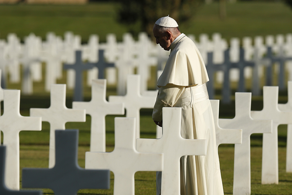 Pope Francis prays in the Sicily-Rome American Cemetery in Nettuno, Italy, Nov. 2, 2017, the feast of All Souls. The cemetery is the resting place of 7,860 American military members who died in World War II. (CNS/Paul Haring)