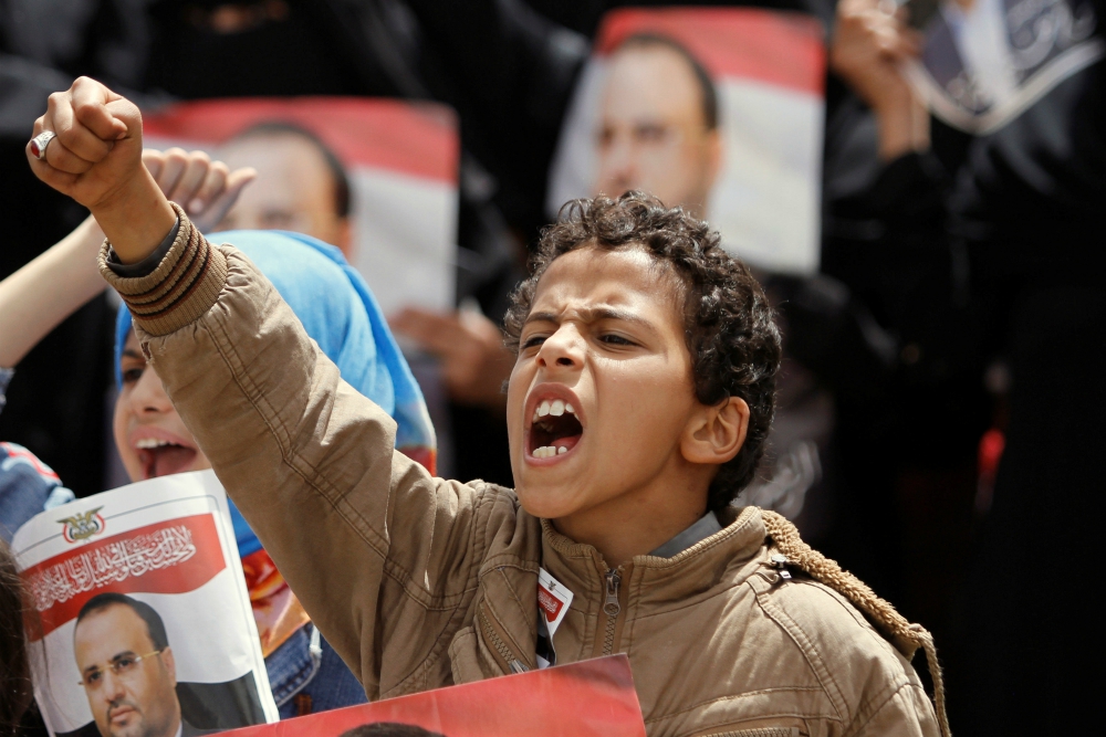 A boy shouts during a protest in Sanaa, Yemen, April 26. Catholic and other faith-based aid groups are urging an end to fighting in Yemen, where three years of war have created a humanitarian crisis. (CNS/Reuters/Mohamed al-Sayaghi)