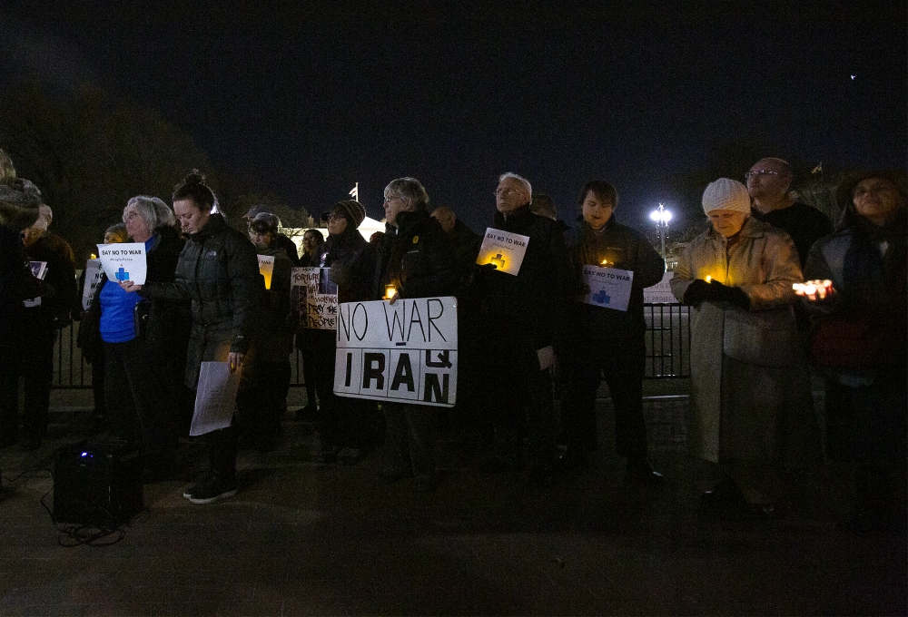 People gather Jan. 6 near the White House in Washington during a candlelight vigil to call for peaceful solutions to rising tensions between the United States and Iran. (CNS/Tyler Orsburn)