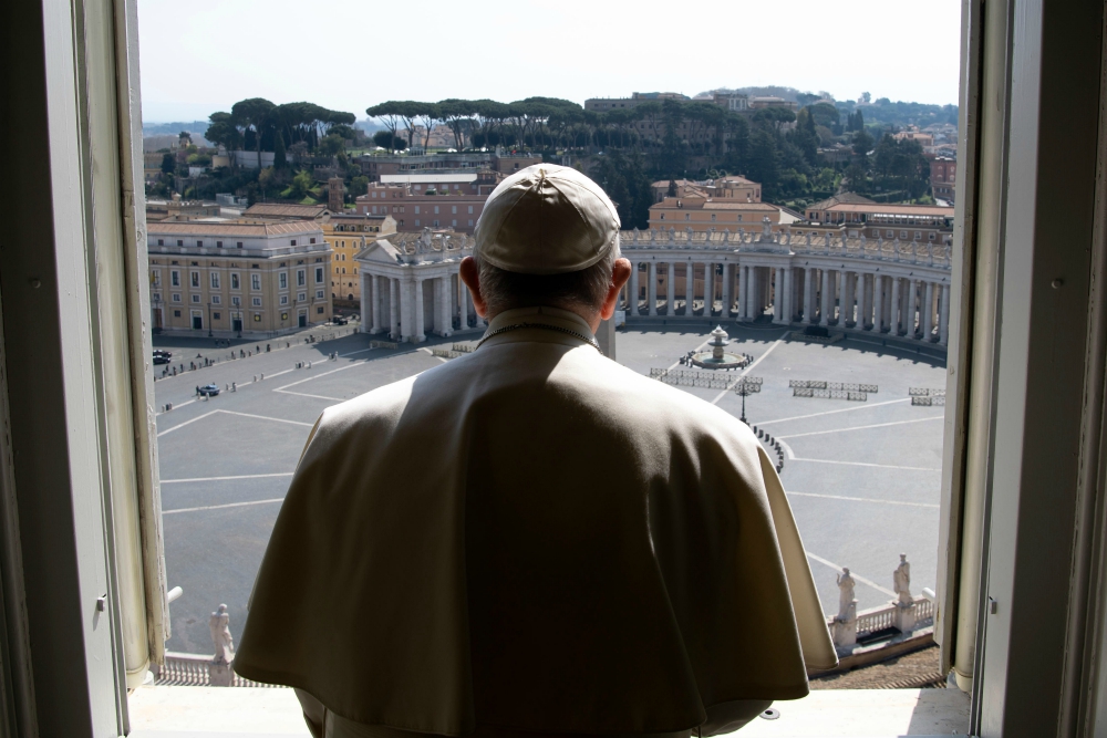 Pope Francis looks over an empty St. Peter's Square after leading a livestream of the recitation of the Angelus from the library of the Apostolic Palace March 22. (CNS/Vatican Media)