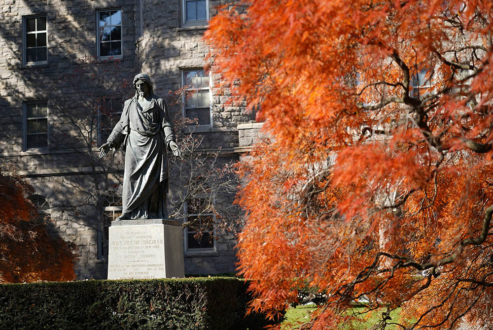 A statue of Jesus is seen amid autumn leaves at St. Joseph's Seminary Nov. 7, 2020, in Yonkers, New York. (CNS/Gregory A. Shemitz)