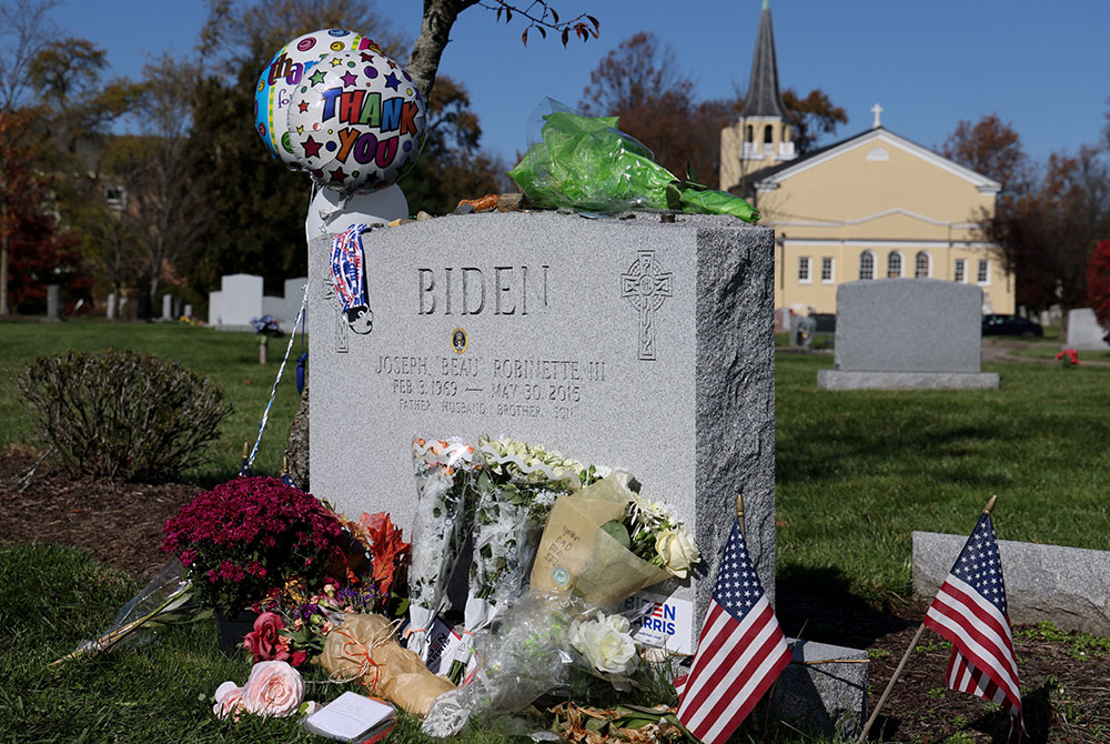 Items left by visitors are seen Nov. 8 at the grave of Beau Biden, President-elect Joe Biden's late son, including a bouquet of flowers reading "Your Dad Did It" at St. Joseph On the Brandywine cemetery in Wilmington, Delaware. (CNS/Jonathan Ernst, Reuter