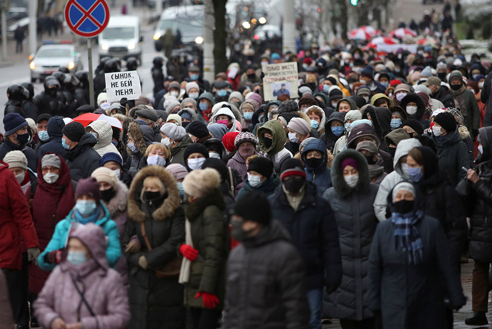 People take part in an opposition rally to demand the resignation of Belarusian President Alexander Lukashenko and to protest police violence Nov. 30, 2020, in Minsk, Belarus. (CNS/Reuters)