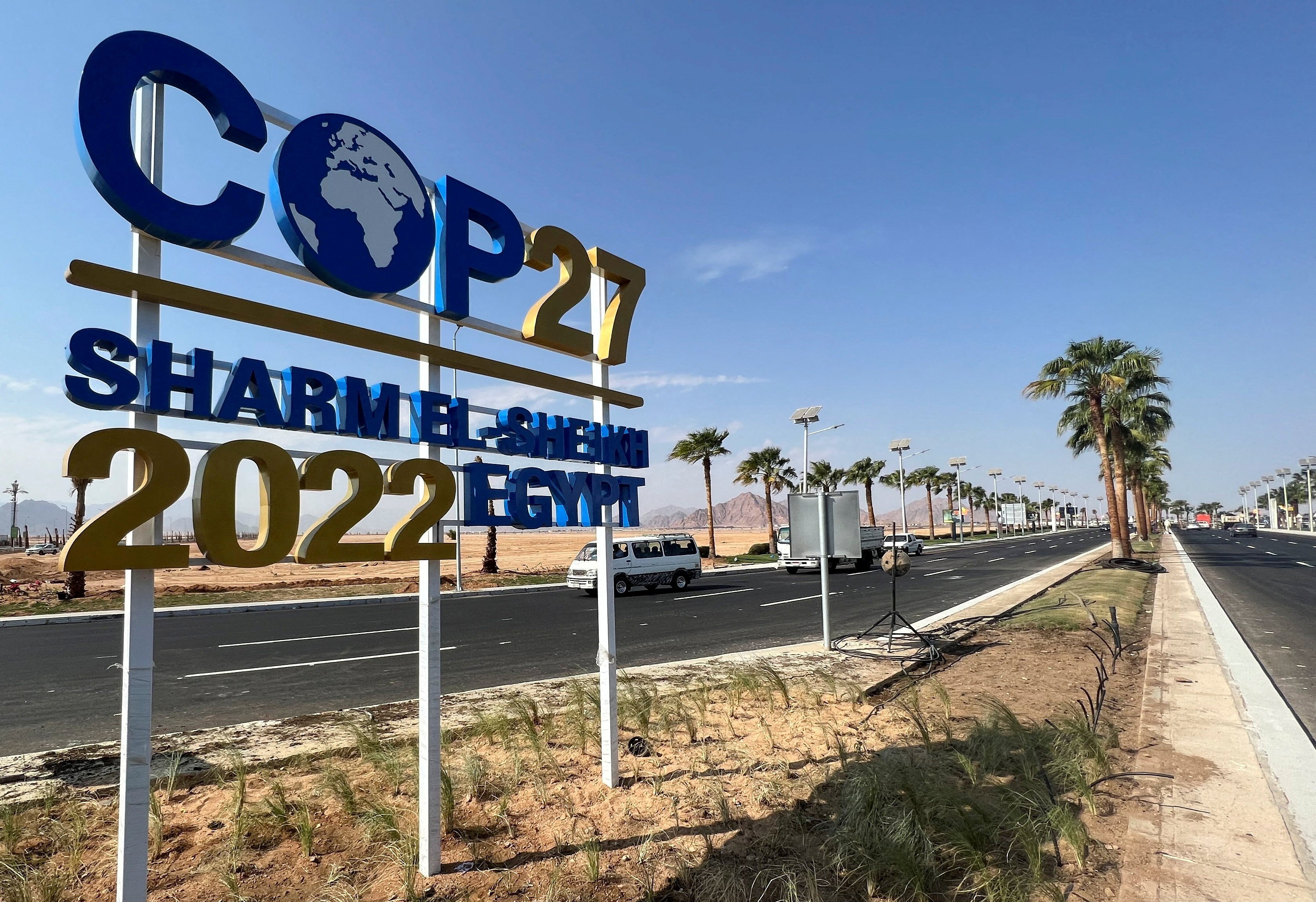 The COP27 sign is displayed along a road leading to the conference area in Egypt's Red Sea resort of Sharm el-Sheikh, the host of Nov.6-18 COP27 summit. (CNS/Reuters/Sayed Sheasha)