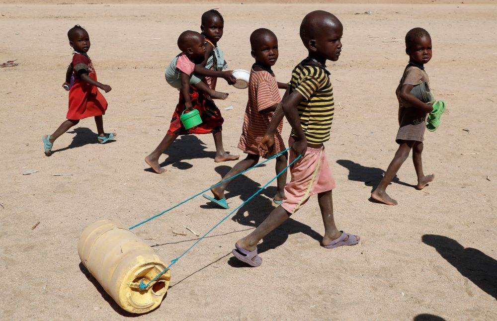 A child affected by the worsening drought due to failed rain seasons pulls a jerrycan of water at Sopel village in Turkana, Kenya, Sept. 27, 2022. (CNS/Reuters/Thomas Mukoya)