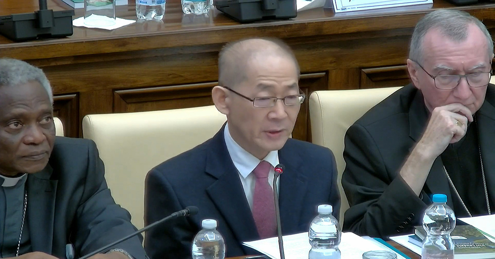 Hoesung Lee, chair of the United Nations Intergovernmental Panel on Climate Change, speaks during an Oct. 4 event at the Vatican marking its entry into the Paris Agreement. Seated by him are Cardinal Peter Turkson, left, and Cardinal Pietro Parolin, right. (NCR screenshot)