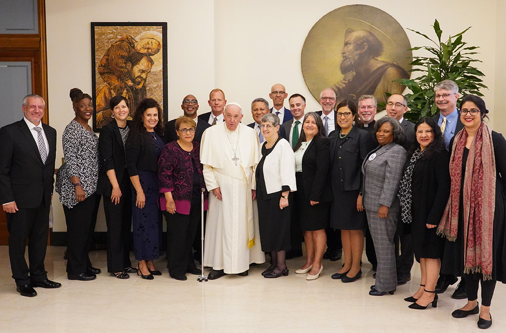 The interfaith delegation from the West/Southwest Industrial Areas Foundation network poses with Pope Francis during their October visit in Rome. The pope said, "'Yes, you're going to be told not to meddle in political issues, going to be told this is just communist stuff. But keep going,'" recalled Colorado organizer Jorge Montiel. "That was a great confirmation, a validation that we are on the right path." (Courtesy of West/Southwest Industrial Areas Foundation)