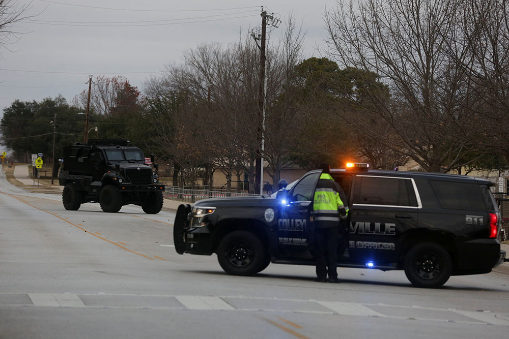 Law enforcement vehicles in Colleyville, Texas, are seen Jan. 15 near the area where a man took four people hostage at a synagogue. (CNS/Reuters/Shelby Tauber)