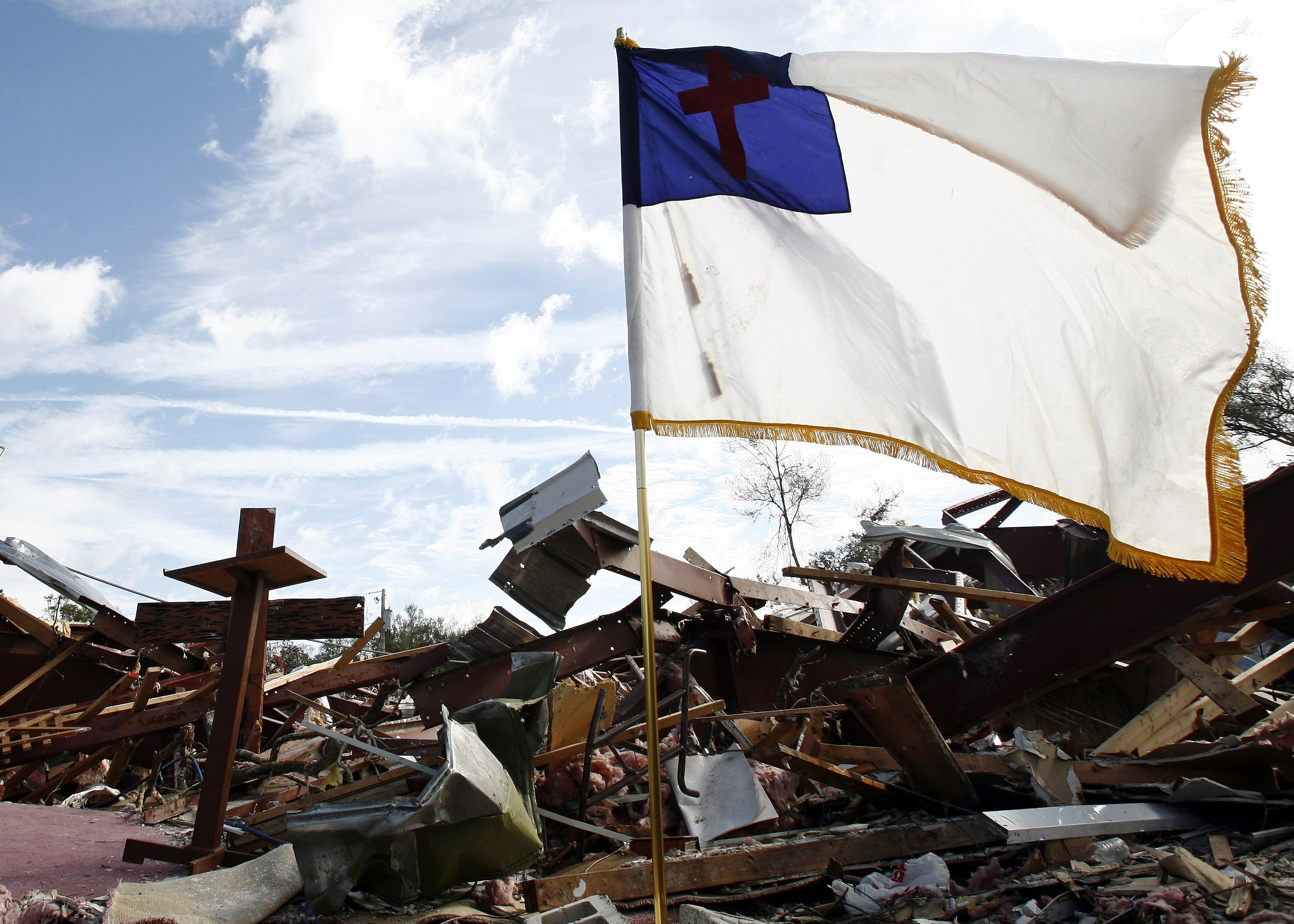 A Christian flag is seen in 2007 amid tornado rubble in Lady Lake, Fla., in this illustration photo. The flag pictured is like the one the group Camp Constitution wanted to have fly outside Boston's City Hall and city officials denied it in 2017. (CNS pho