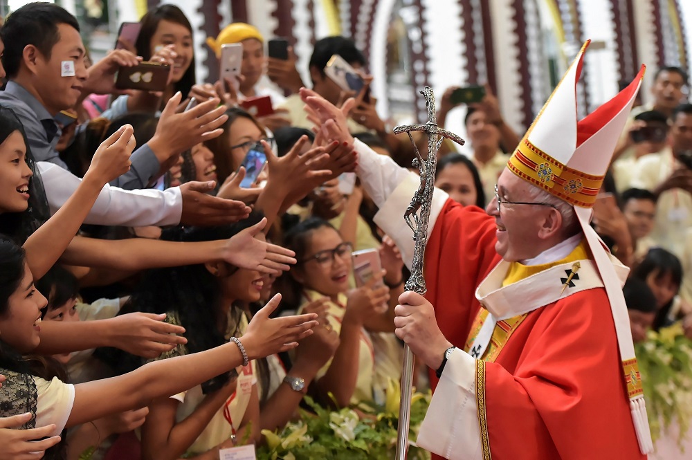 Pope Francis greets young people after celebrating Mass Nov. 30, 2017, at St. Mary's Cathedral in Yangon, Myanmar.