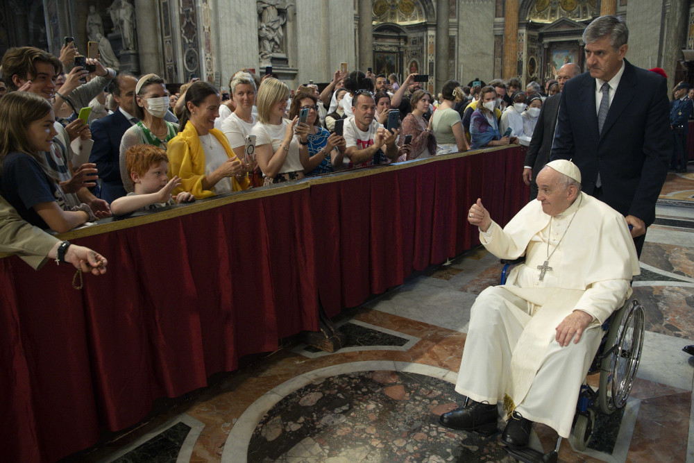 Pope Francis greets people after participating in Mass for the feast of Pentecost in St. Peter's Basilica at the Vatican June 5. (CNS/Vatican Media)