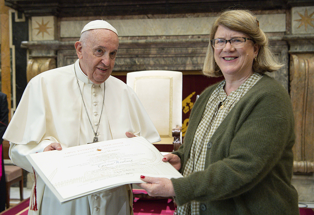 Pope Francis presents the Ratzinger Prize to Australian professor Tracey Rowland during a ceremony Nov. 13, 2021, at the Vatican. The prize was also given to German professors Hanna-Barbara Gerl-Falkovitz and Ludger Schwienhorst-Schönberger; and French professor Jean-Luc Marion. (CNS/Vatican Media)