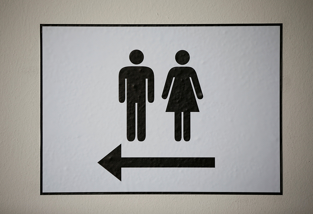 A sign illustrates men's and women's restrooms. (OSV News/Reuters/Wolfgang Rattay)