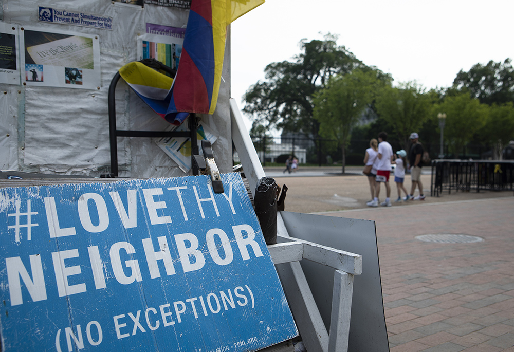 A "Love Thy Neighbor: No Exceptions" sign is seen near the White House July 7, 2021, in Washington. (CNS/Tyler Orsburn)
