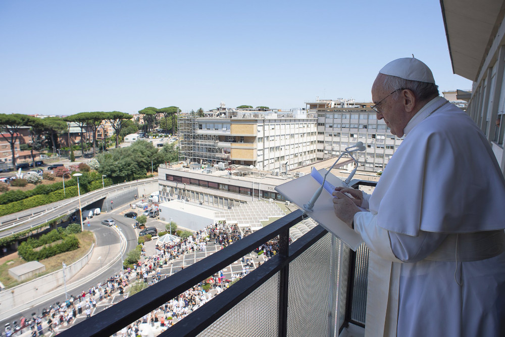 Pope Francis prays the Angelus from the balcony of his room at Gemelli hospital in this file photo taken in Rome July 11, 2021, when the pope was in the hospital for 10 days to recover from a scheduled colon surgery. (CNS photo/Vatican Media)