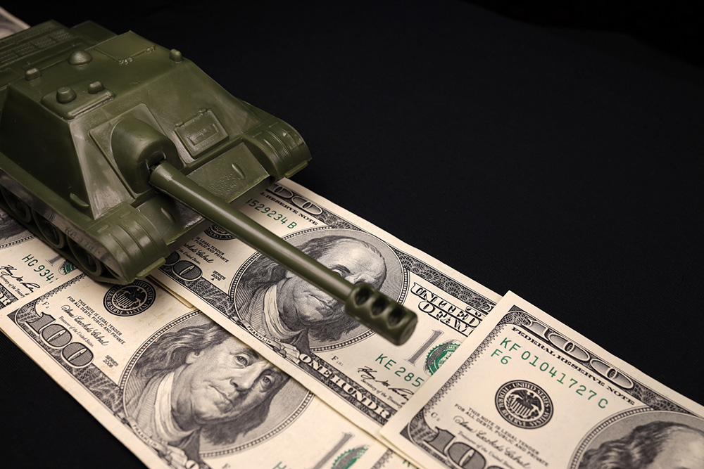 Military tank on top of $100 bills (Dreamstime/Michael Nesterov)