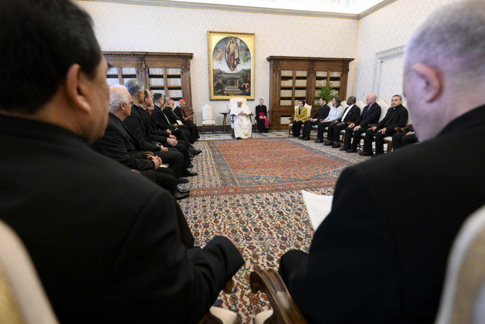 Pope Francis meets with members of the Pontifical Biblical Commission April 20, 2023, in the library of the Apostolic Palace at the Vatican. (CNS photo/Vatican Media)