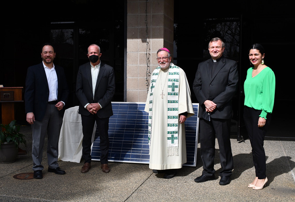 Bishop Jaime Soto blessed the solar panel installation at St. Anthony Parish, in Sacramento, during a prayer service Feb. 20, 2022. Also pictured, from left: Kim-Son Ziegler, parish environmental lead; Mayor Darrell Steinberg; Pastor Fr. Mitch Maleszyk, and Gabby Trejo, Sacramento ACT executive director. (Courtesy of Kim-Son Ziegler)