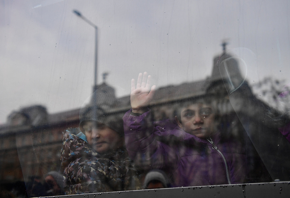 Children of refugees fleeing from Russia's invasion of Ukraine wait for transport at Nyugati railway station Feb. 28, 2022, in Budapest, Hungary. (CNS/Reuters/Marton Monus)