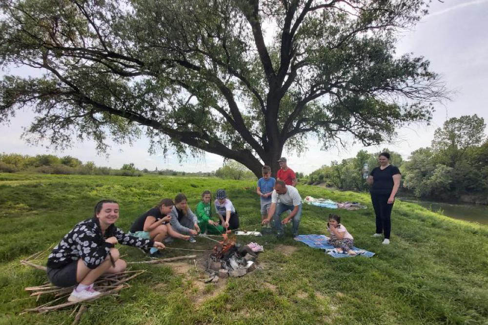 As part of the 2023 Run4Unity on May 7, organized by the youth branch of the lay Catholic-led Focolare Movement, teens in Uzhhorod, Ukraine, cleaned up trash around the Church of the Nativity of Mary and held a picnic. (Courtesy of Focolare Movement)