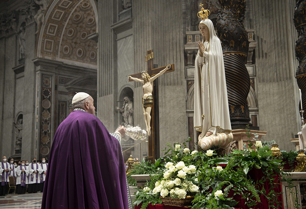 Pope Francis burns incense in front of a Marian statue after consecrating the world and, in particular, Ukraine and Russia to the Immaculate Heart of Mary during a Lenten penance service in St. Peter's Basilica March 25, 2022, at the Vatican. A year later, he asked Catholics worldwide to renew the consecration and pray for peace. (CNS/Vatican Media)