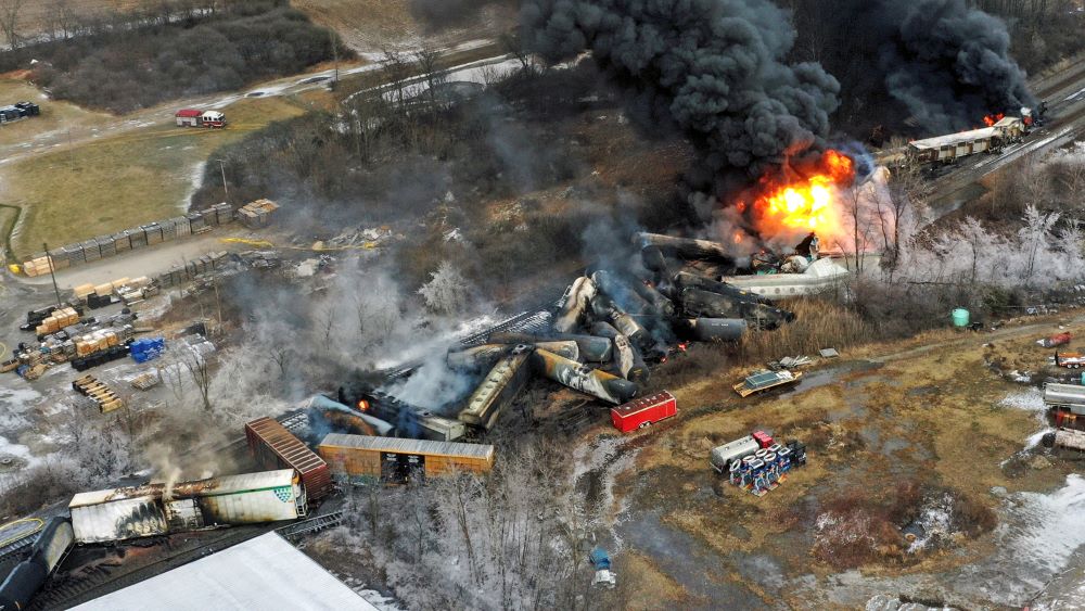 This photo taken with a drone shows portions of a Norfolk Southern freight train that derailed Feb. 3, 2023, in East Palestine, Ohio, still on fire at midday the next day. (AP Photo/Gene J. Puskar)