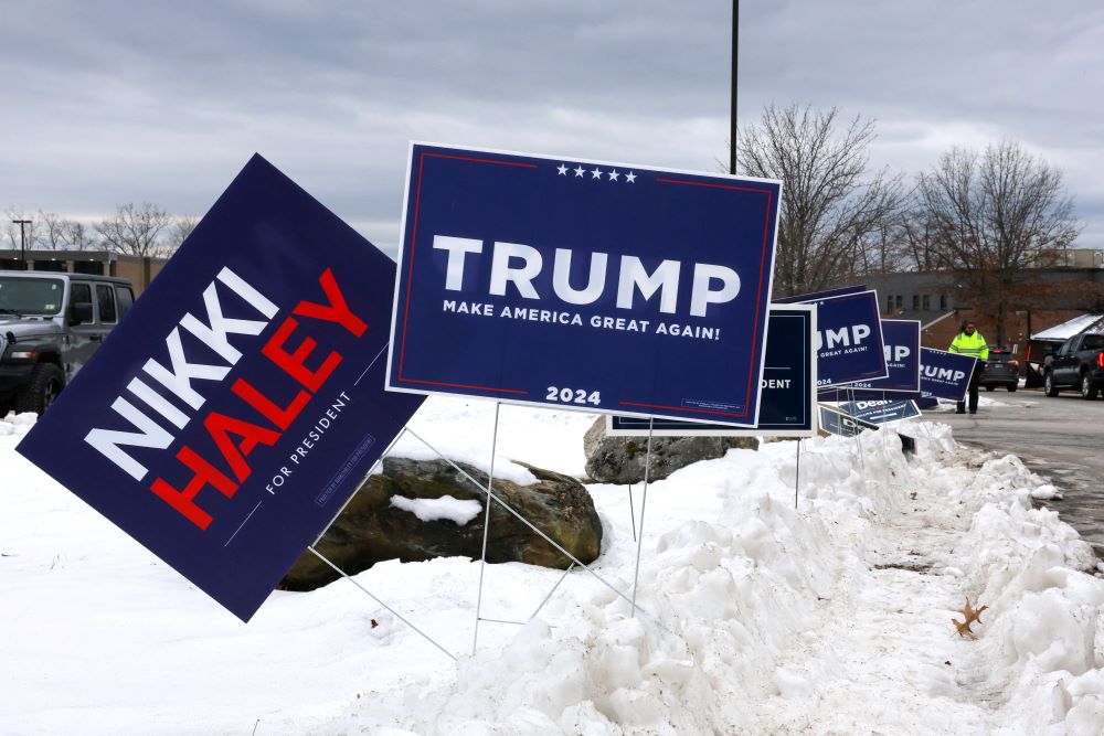 Campaign signs for Republican presidential candidates Nikki Haley, former U.S. ambassador to the United Nations, and former President Donald Trump are seen outside Londonderry High School in Londonderry during the New Hampshire presidential primary election on Jan. 23.