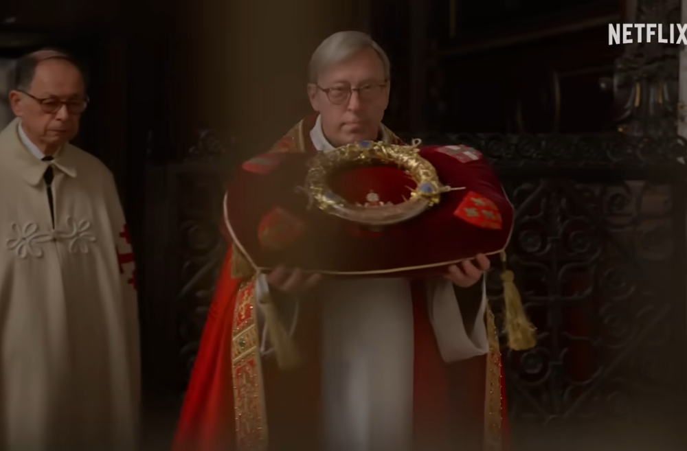 A priest carries the crown of thorns in an image from the Netflix series "Mysteries of the Faith." The relic, held at Notre Dame Cathedral in Paris since the French Revolution, was quickly retrieved from the church when a fire started there April 15, 2019. 