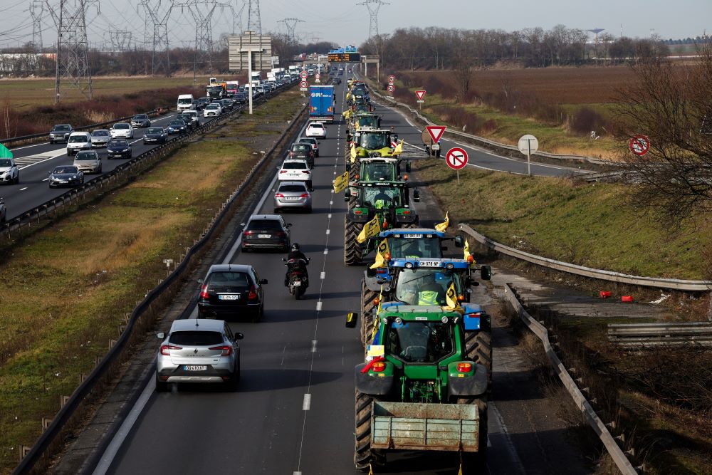 French farmers drive their tractors in a go-slow operation in Compans Jan. 27, 2024, near Roissy Charles-de-Gaulle Airport in a protest over price pressures, taxes and green regulation, grievances shared by farmers across Europe, (OSV News photo/Benoit Tessier, Reuters)