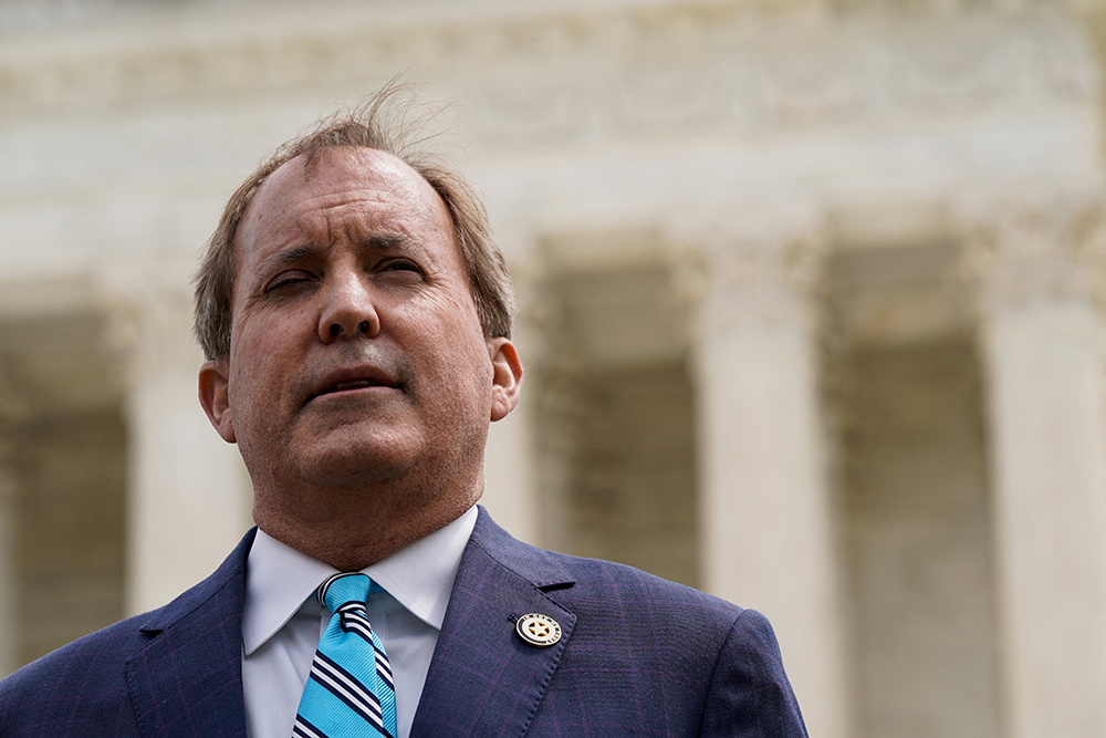 Texas Attorney General Ken Paxton speaks during a news conference in Washington April 26, 2022, after the U.S. Supreme Court heard oral arguments in President Joe Biden's bid to rescind a Trump-era immigration policy that forced migrants to stay in Mexico to await U.S. hearings on their asylum claims. (CNS/Reuters/Elizabeth Frantz)