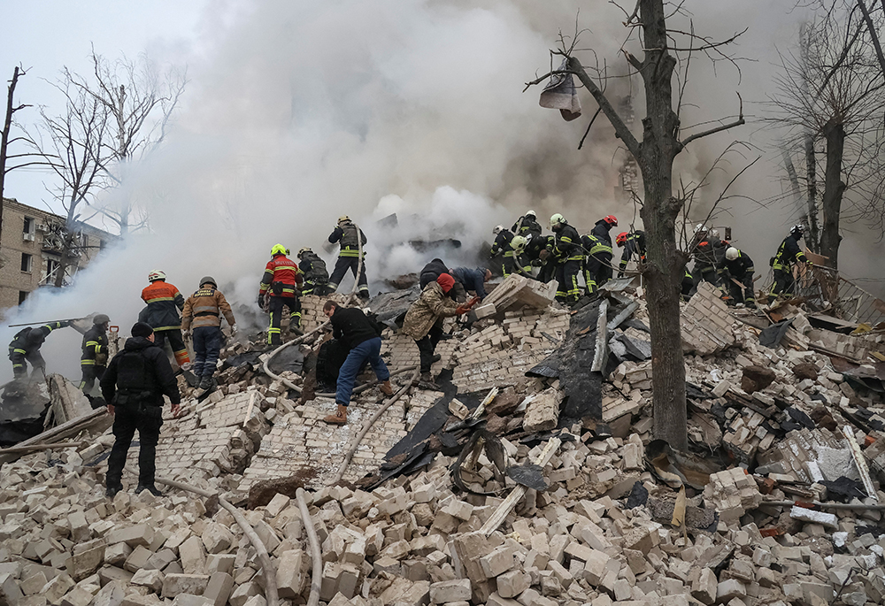 Rescuers work at the site of a residential building in Kharkiv, Ukraine, Jan. 23, 2024, that was heavily damaged in a Russian missile attack. (OSV News/Reuters/Sofiia Gatilova)