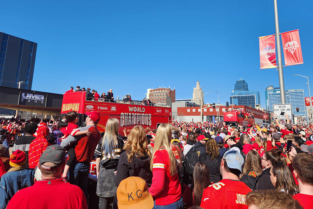Fans of the Kansas City Chiefs line Grand Avenue in downtown Kansas City, Missouri, for the Super Bowl parade on Feb. 14. Hours later, gunfire at the celebration rally at Union Station would kill one person and injure 22 others. (NCR photo/Brian Roewe)