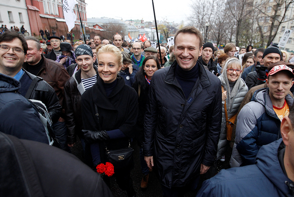 Russian opposition leader Alexei Navalny and his wife, Yulia, are pictured in a file photo walking during an opposition rally in Moscow. Navalny died at age 47 Feb. 16, 2024, at a remote prison camp. (OSV News/Reuters/Maxim Shemetov)