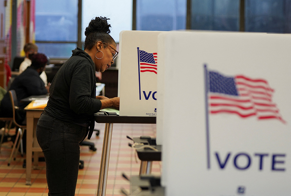 A woman casts her ballot at a polling station in Detroit as Democrats and Republicans held their Michigan presidential primary Feb. 27. (OSV News/Reuters/Dieu-Nalio Chery)