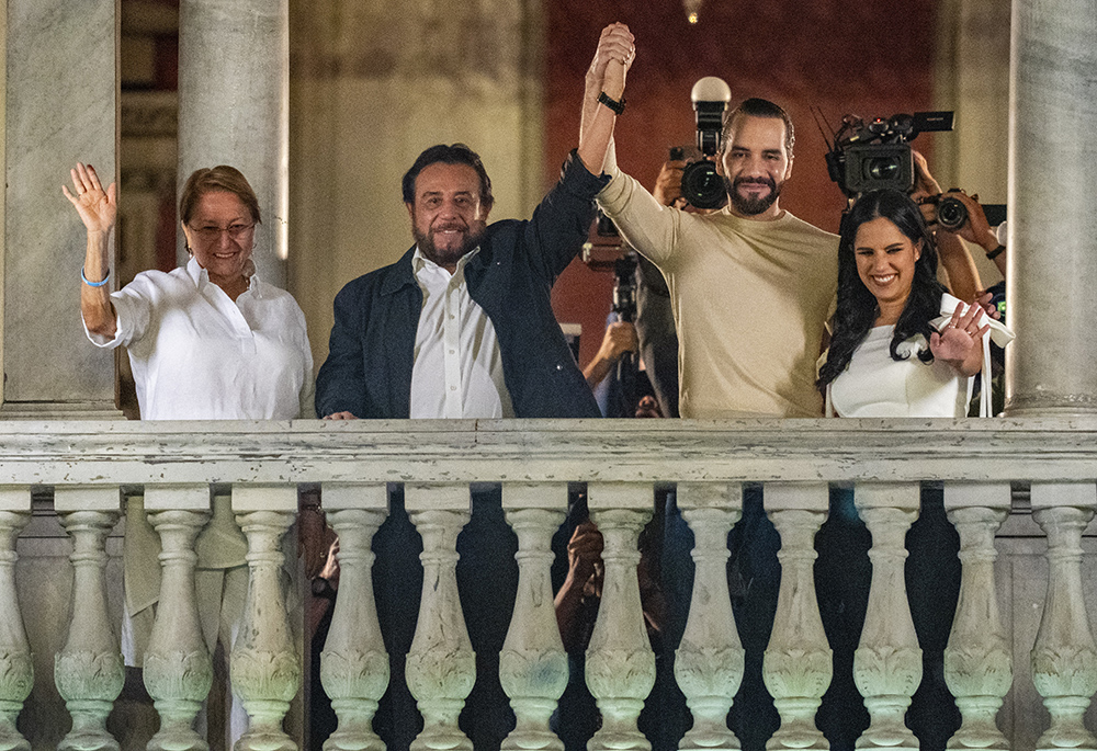 El Salvador President Nayib Bukele, second from right, his wife Gabriela Rodriguez, right, running mate and Vice President Félix Ulloa, second from left, and his wife Lilian Alvarenga wave to supporters from the balcony of the presidential palace after general elections polls closed Feb. 4 in San Salvador, El Salvador. (AP photo/Moises Castillo)