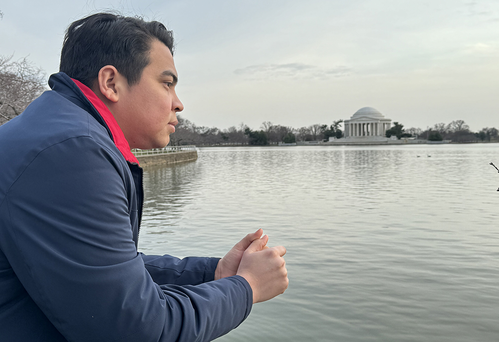 Miguel Flores looks over the Tidal Basin in Washington on Feb. 22, almost a year after being expelled and stripped of his citizenship in Nicaragua. He said he will keep talking about his home country and abuses committed by the Ortega government. (NCR photo/Rhina Guidos)