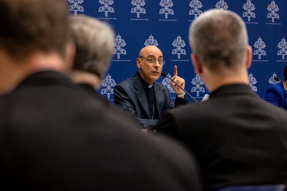 Cardinal Víctor Manuel Fernández, prefect of the Dicastery for the Doctrine of the Faith, speaks at a news conference to present the dicastery's declaration Dignitas Infinita at the Vatican press office April 8. Priests from the dicastery's doctrinal section joined reporters for the presentation. (CNS/Pablo Esparza)
