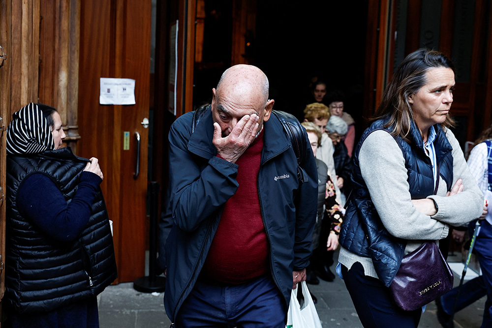 A man reacts while leaving Santiago Cathedral in Bilbao, Spain, after a Mass celebrated March 24, 2023, to recognize and apologize to victims of sexual abuse within the Catholic Church. The Mass was concelebrated by Bishop Joseba Segura of Bilbao and Fr. Josu Lopez Villalba, a victim of sexual abuse. (OSV News/Reuters/Vincent West)