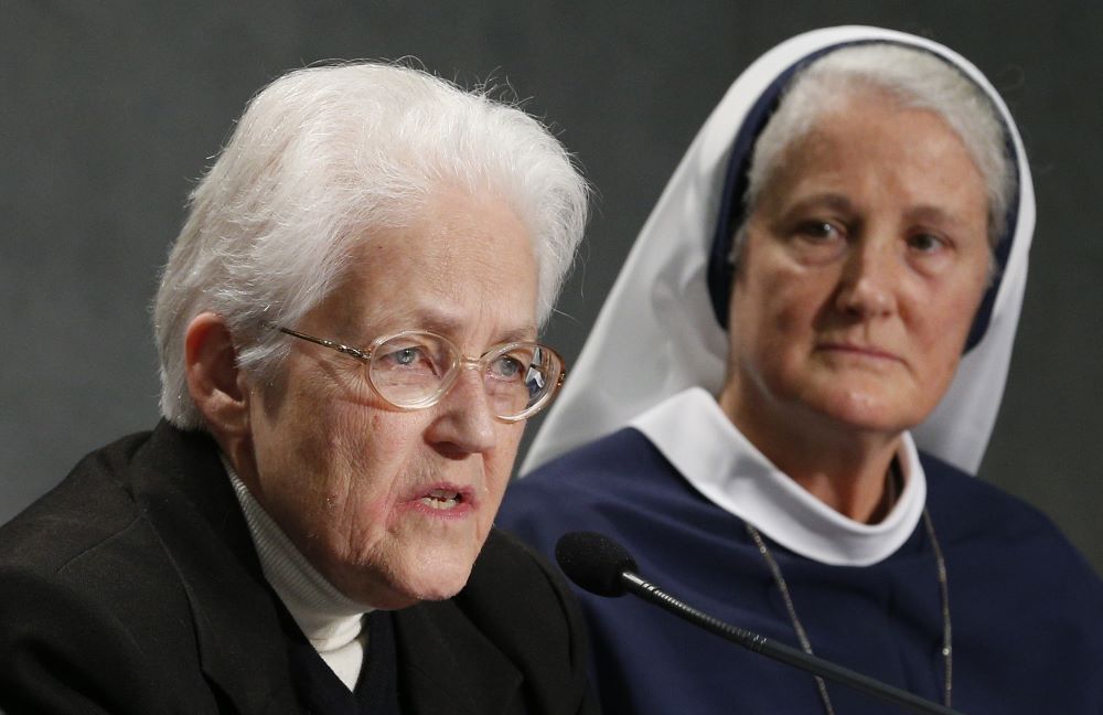 Sr. Sharon Holland (left), then president of the Leadership Conference of Women Religious, speaks as Sr. Agnes Mary Donovan, coordinator of the Council of Major Superiors of Women Religious, listens during a Dec. 16, 2014, Vatican press conference.