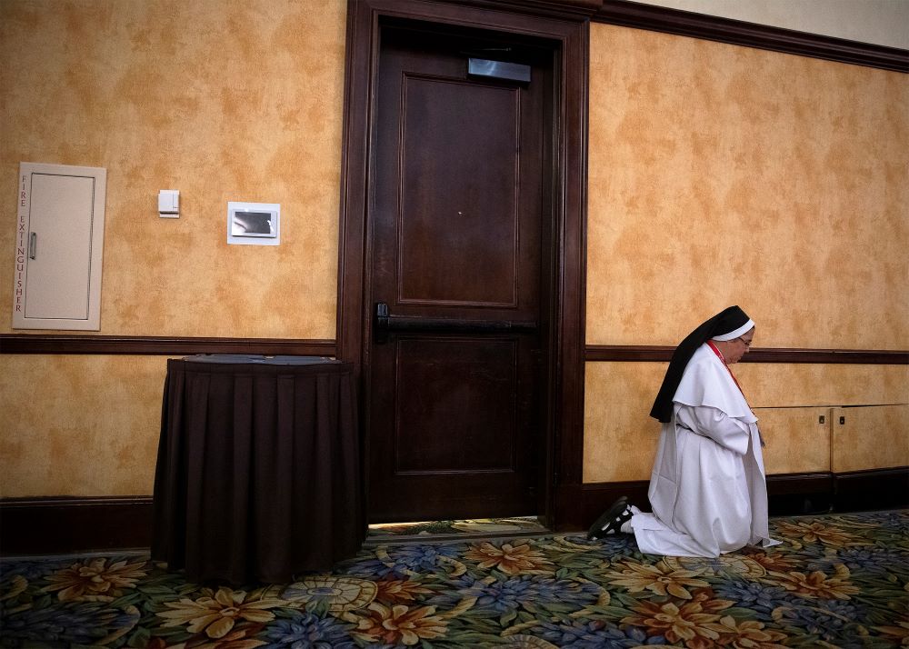 A woman religious prays Sept. 21, 2018, during the Fifth National Encuentro in Grapevine, Texas. 