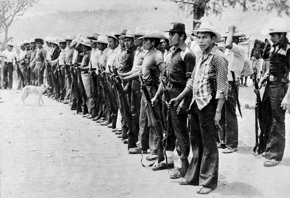 Civil patrol members of the Rabinal Department of Baja Verapaz in the north of Guatemala are seen carrying U.S.-made M-1 rifles March 6, 1982. (AP)