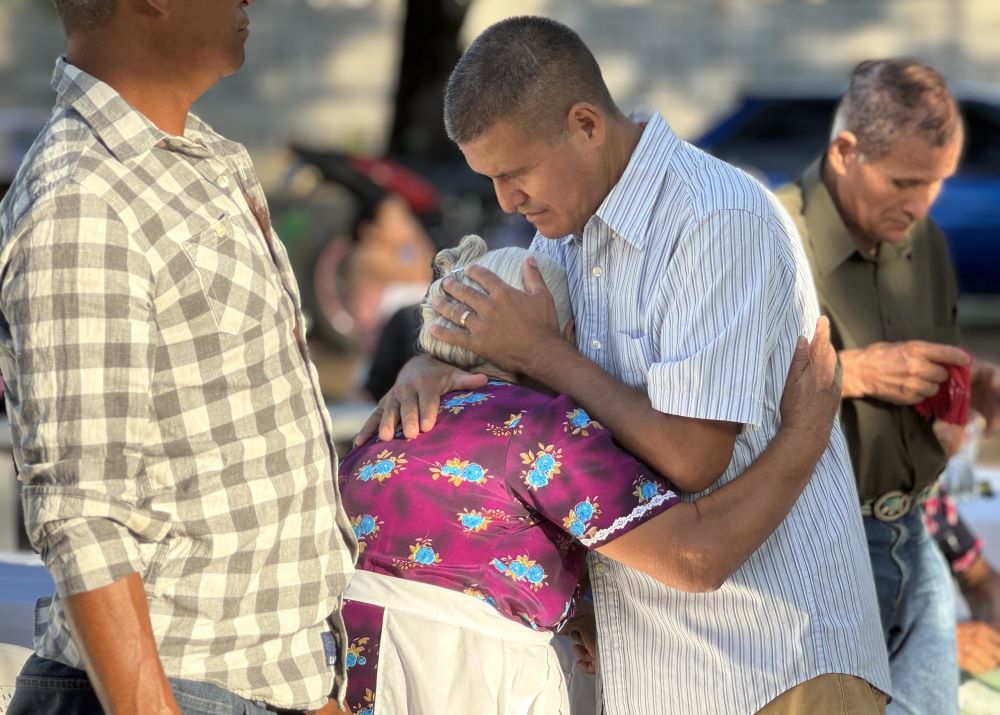 Santos Alfaro Ayala hugs his mother during Mass April 13, 2024 in Guarjila, El Salvador. Alfaro, a Catholic husband and father of two, offered his testimony of being unjustly detained for almost three months.
